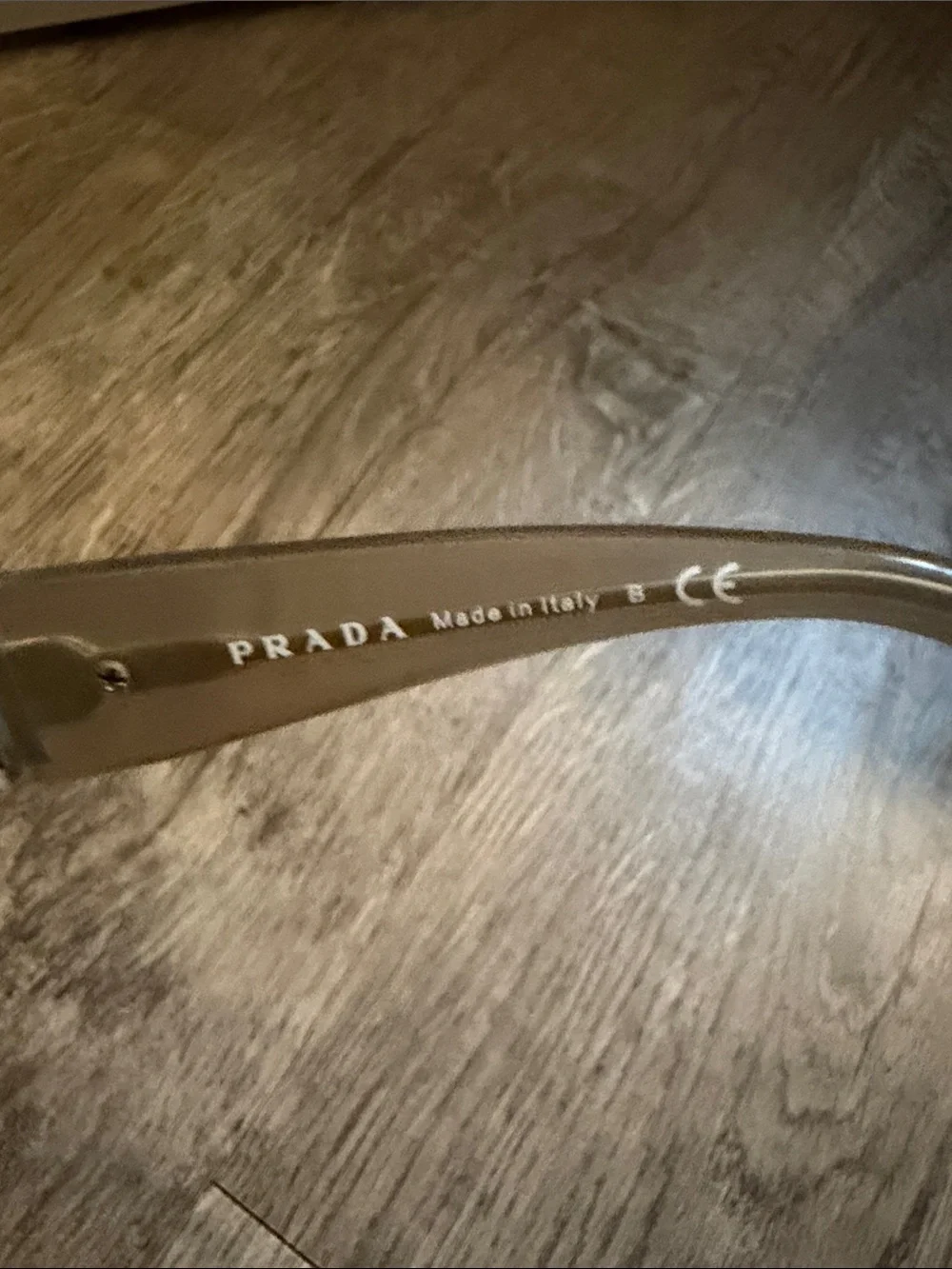 Prada Cat-Eye Sunglasses in Light Gray and Clear
